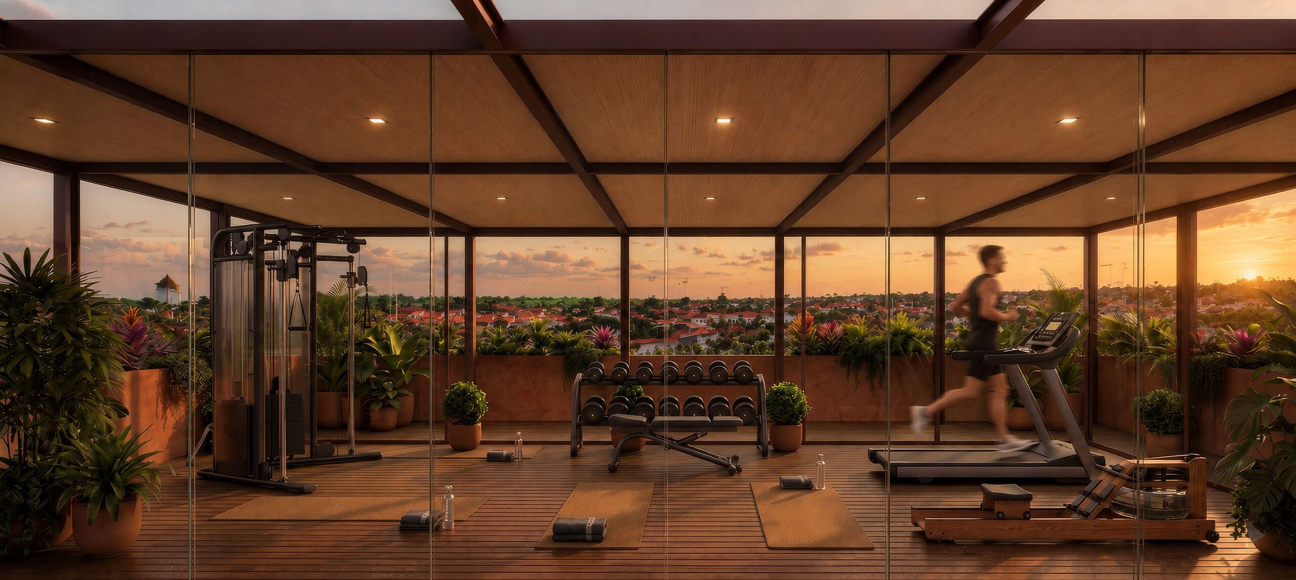 Rooftop gym with glass walls above the palms